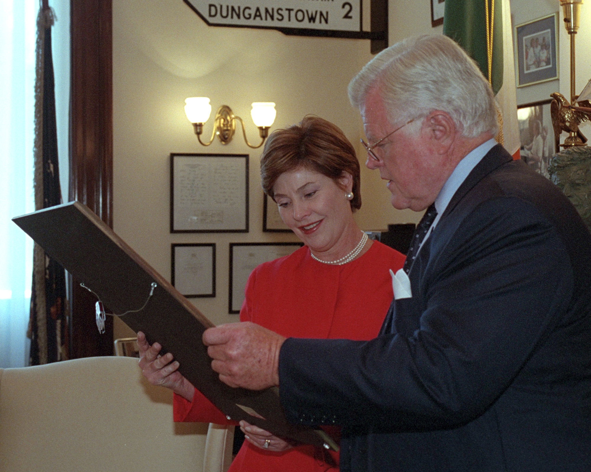 Senator Ted Kennedy shows Mrs. Laura Bush art and memorabilia in his office at the Russell Senate Office Building, September 11, 2001.